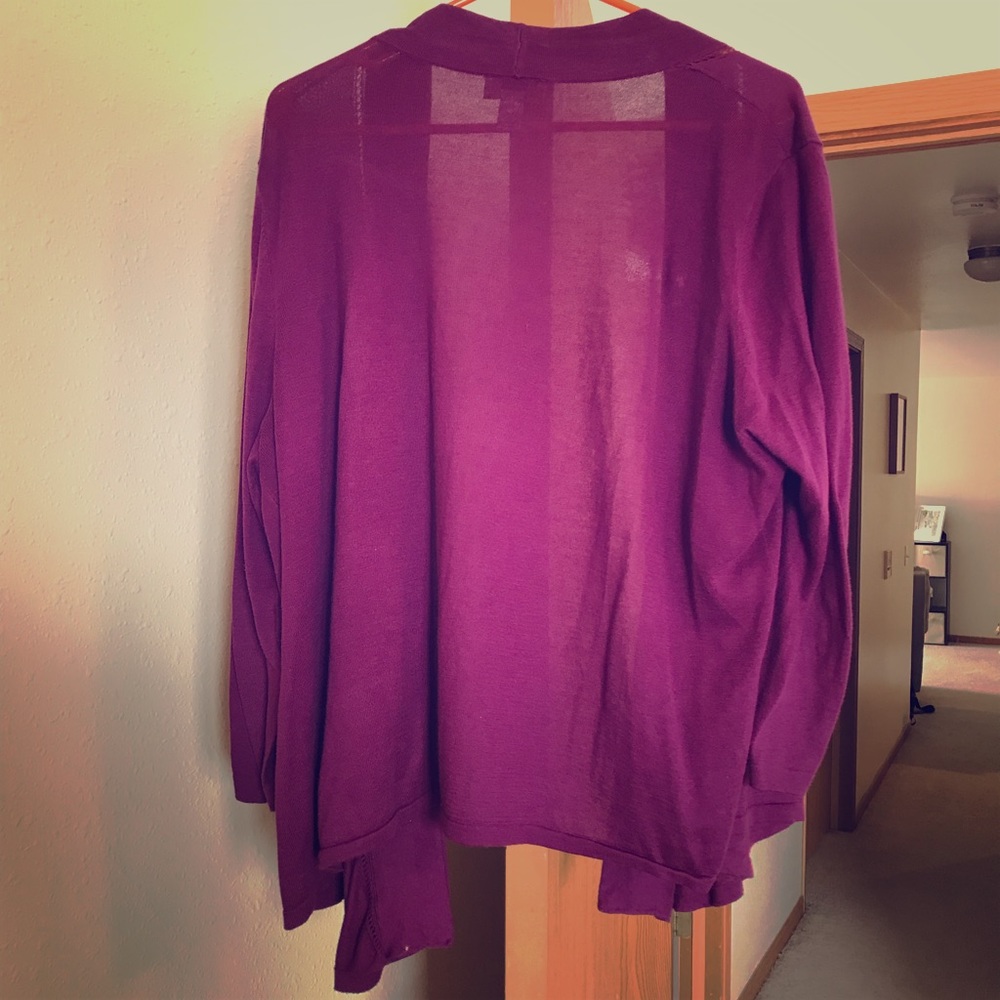 Purple cardigan.